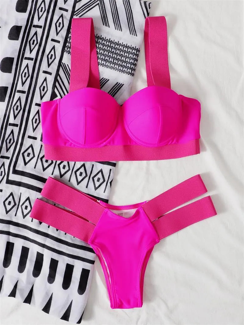 Women's rose red steel bracket push-up bikini swimsuit laid flat.
