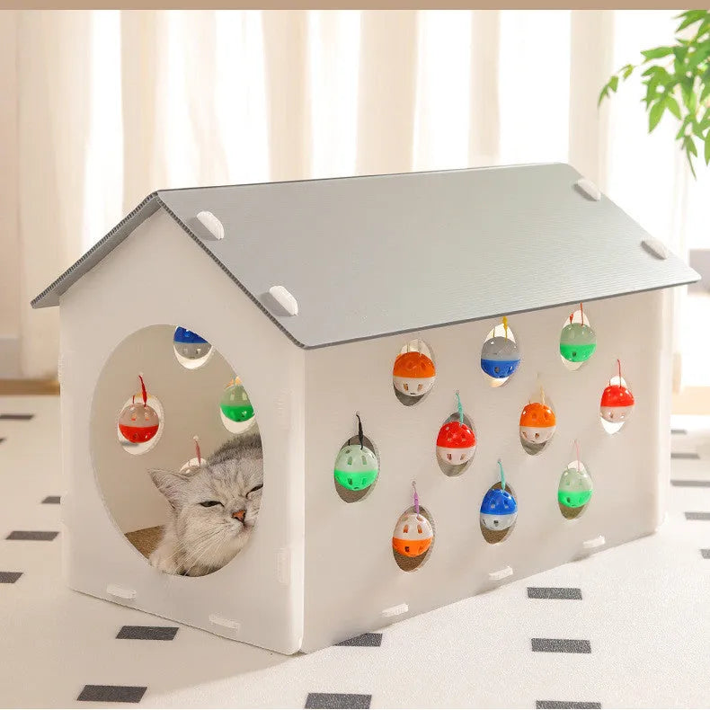 Plastic cat scratch board house with integrated nest bed, bell ball toy, and tunnel opening for indoor feline use