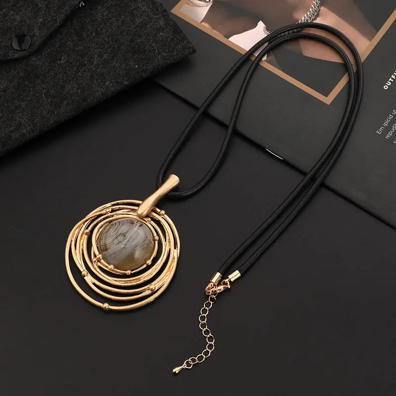 Gold geometric plaid pattern necklace on snakeskin wax rope chain with adjustable length