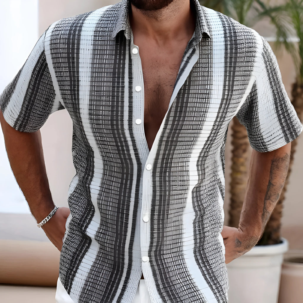 Man wearing a slim-fit short sleeve shirt with a colourful 3D digital printed flower pattern.