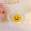 Clear square acrylic storage box with a cute decorative pattern, for stationery on a desk.