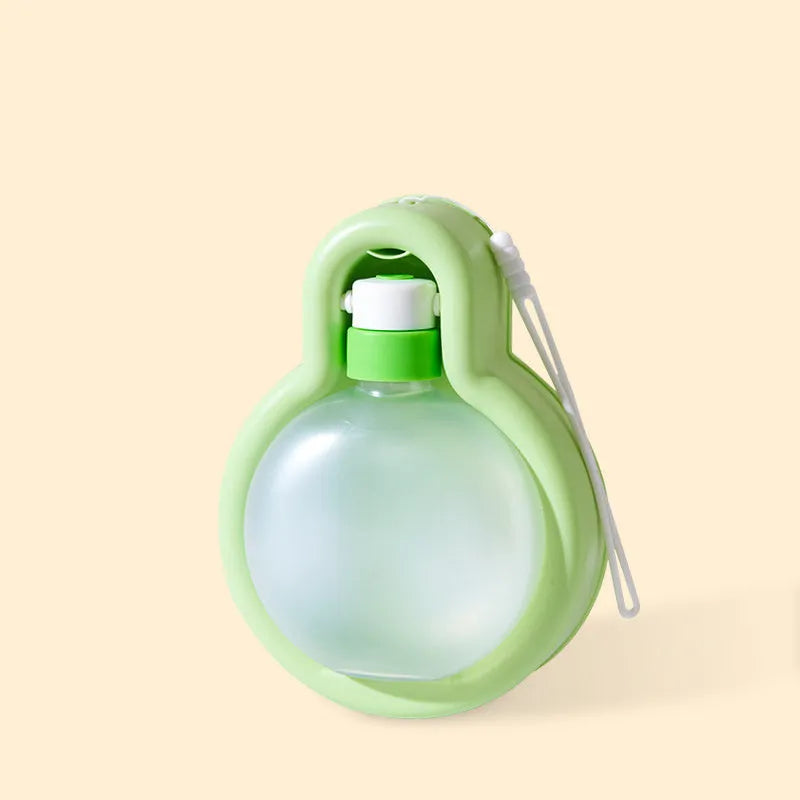 Green portable dog travel water bottle with pull-out drinking bowl, shown with size dimensions.