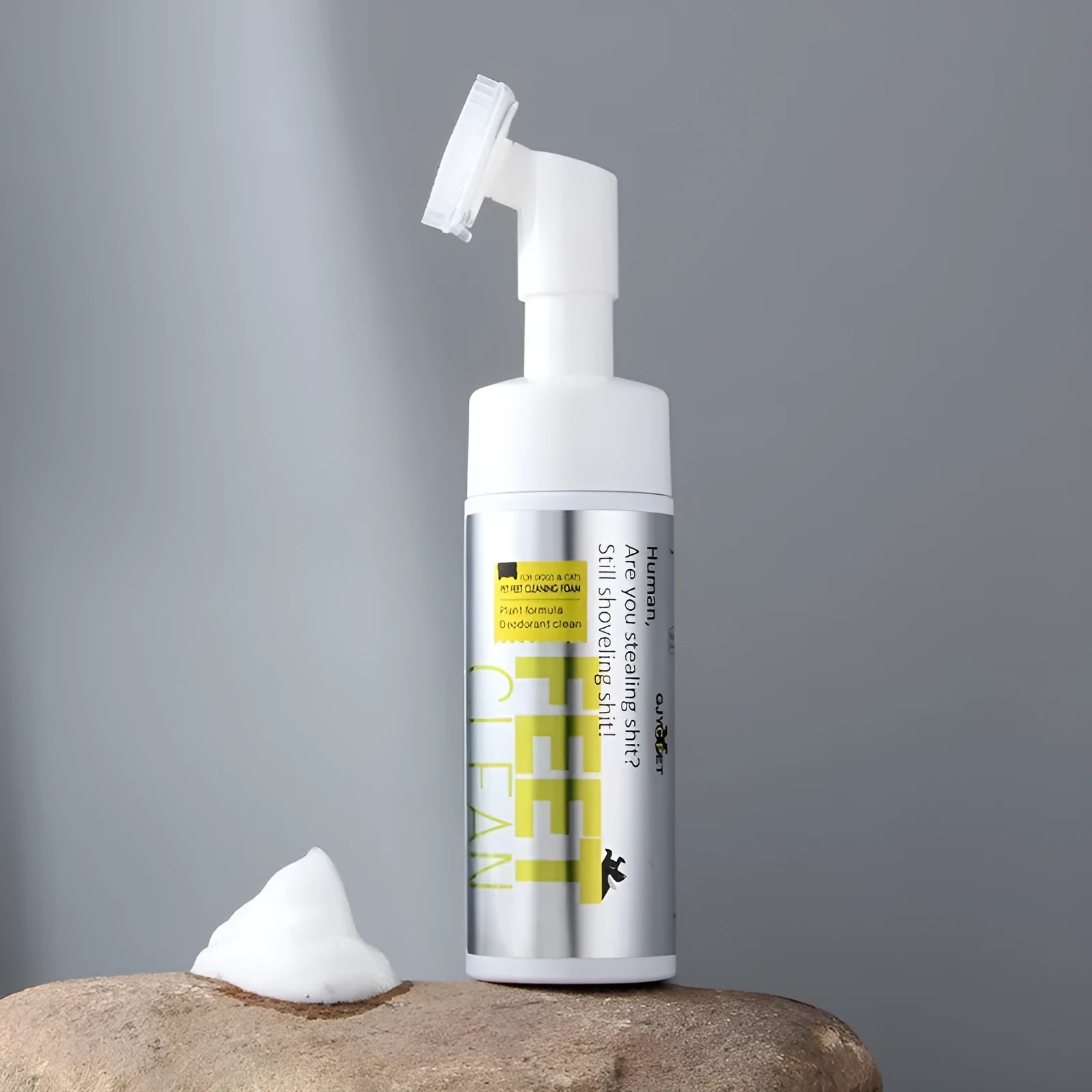 Bottles of pet foot cleaning foam and ear cleanse liquid next to packs of disposable pet wipes for dogs and cats.