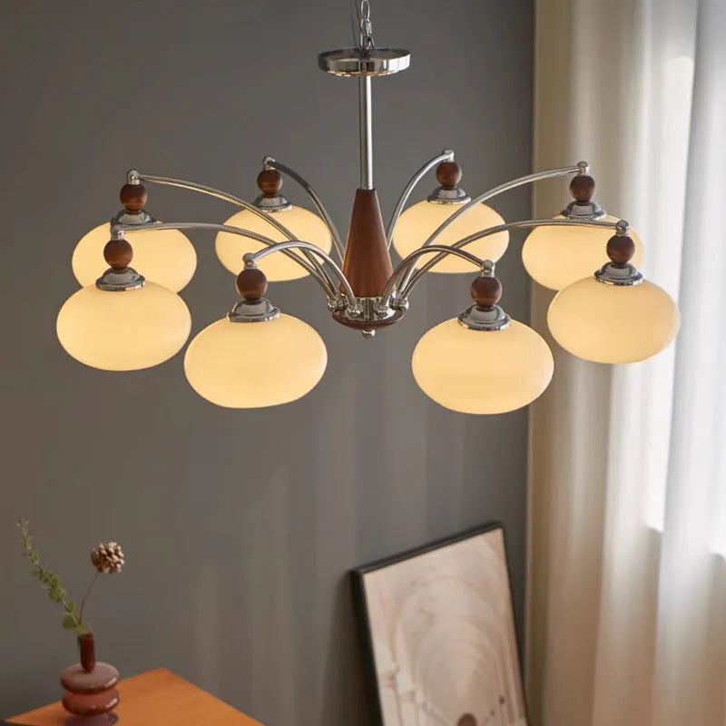 Persimmon glass and chrome chandelier with multiple lampshades in a Middle Ancient style