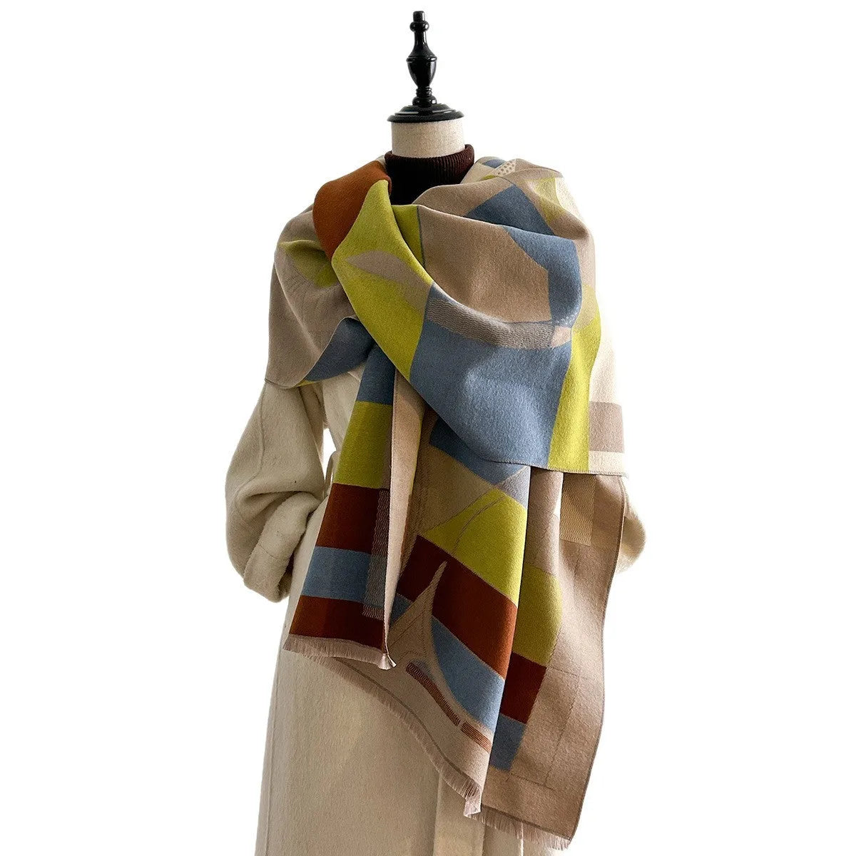 Long beige imitation cashmere scarf draped to show its 185cm length and texture.