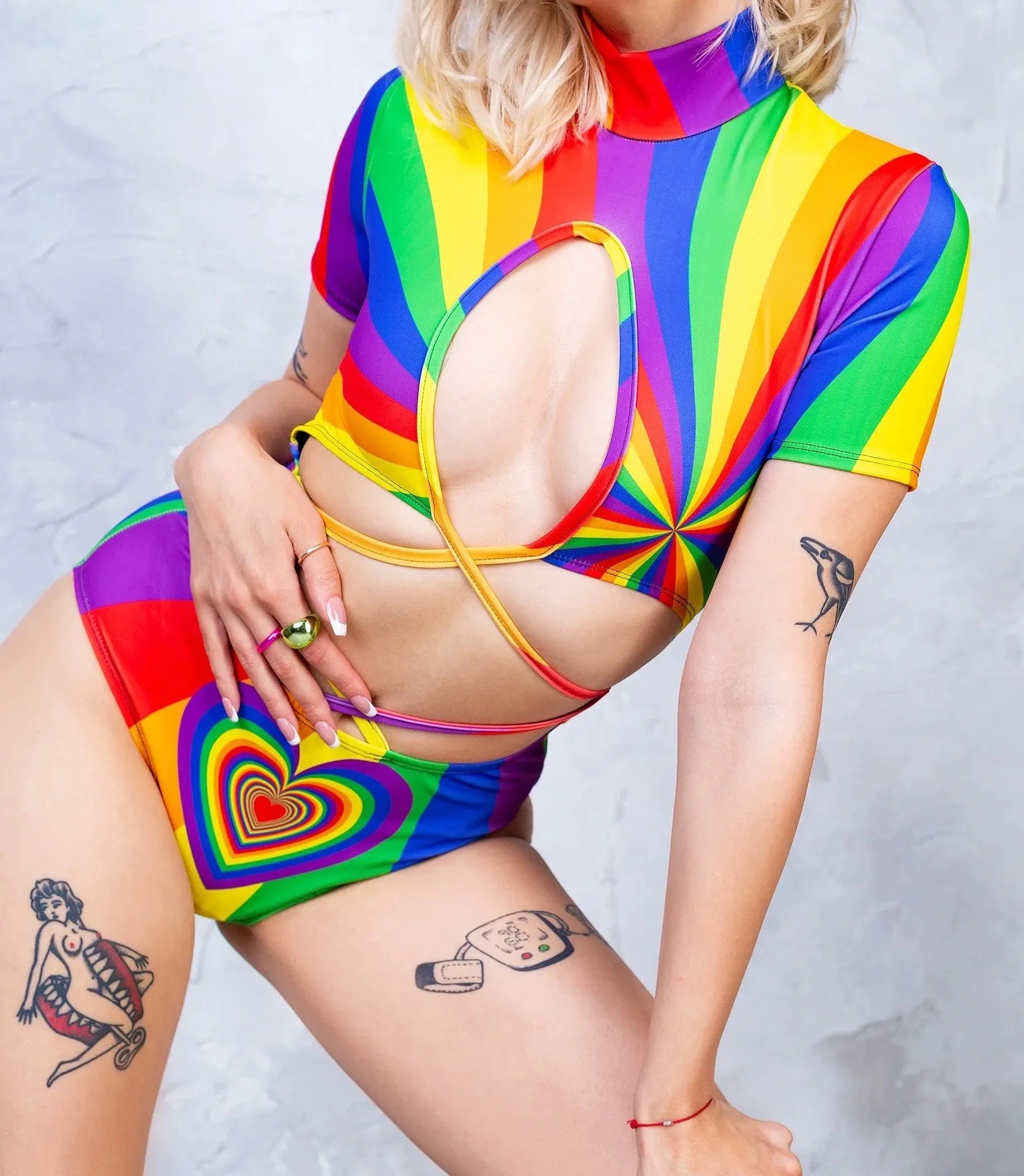 Long sleeve high neck bikini swimsuit on a hanger, shown in a high tie colour pattern.