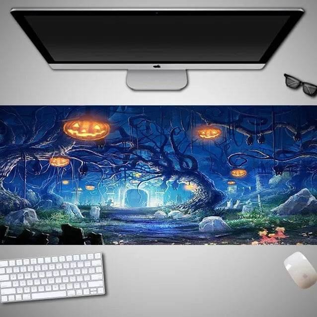 Oversized Halloween-themed computer mouse pad with non-slip rubber cloth base on a desk