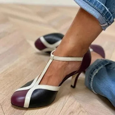 Round toe high heels with button closure in artificial PU and rubber, available in sizes 34-43