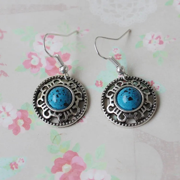 Miao ethnic silver and turquoise earrings with geometric flower disk design and auspicious patterns