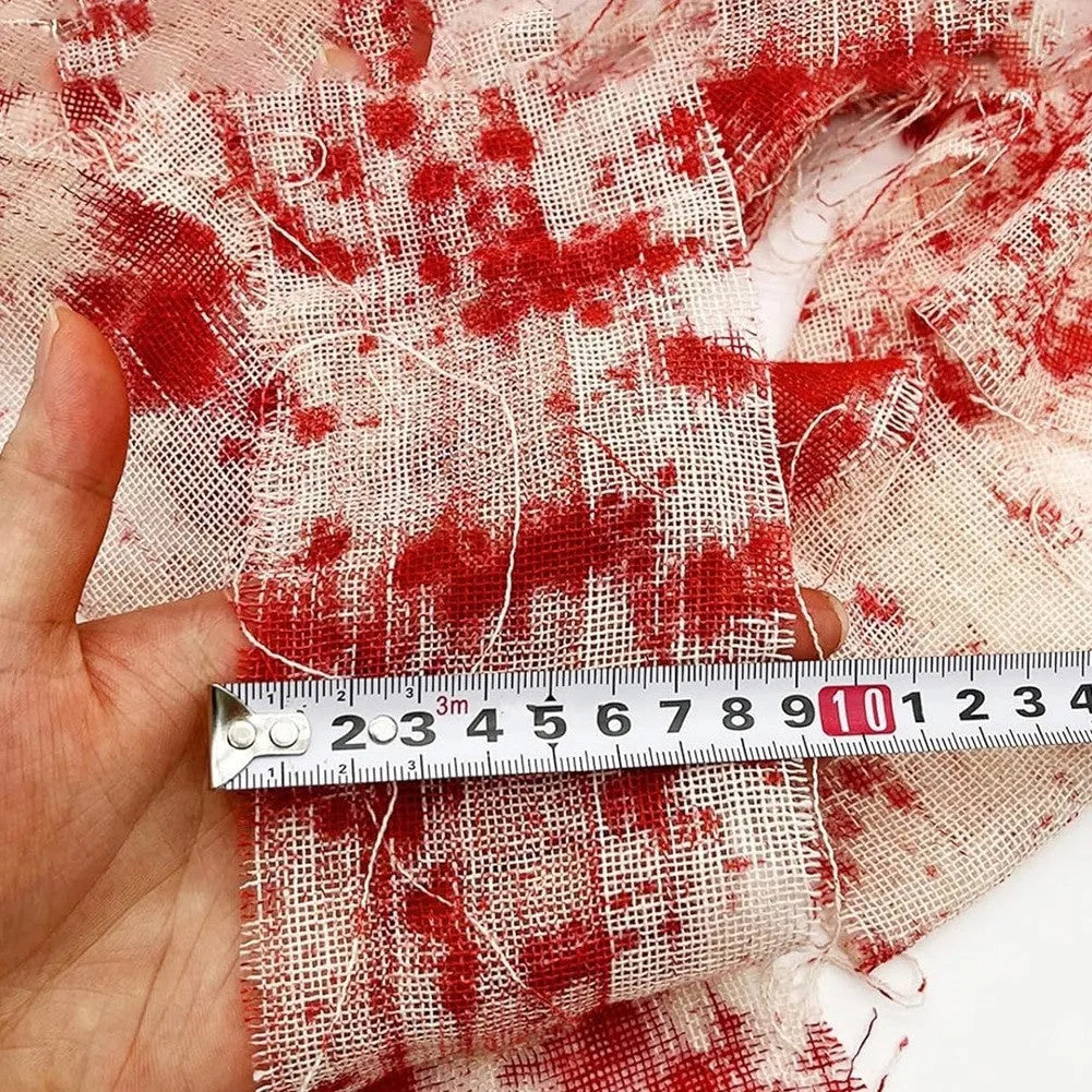 Halloween horror style bloody red dyed gauze bandage roll made from polyester fibre.