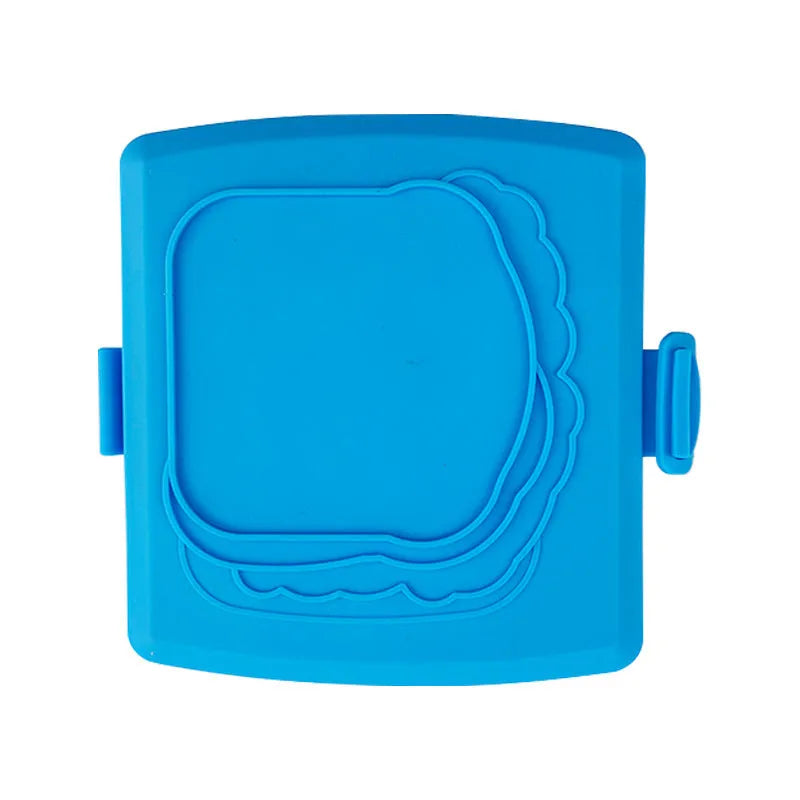 Red silicone baking tray with heat-resistant gloves on kitchen counter