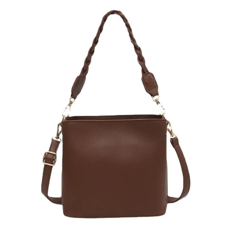 Retro one-shoulder crossbody bucket bag with weaving detail in khaki colour.