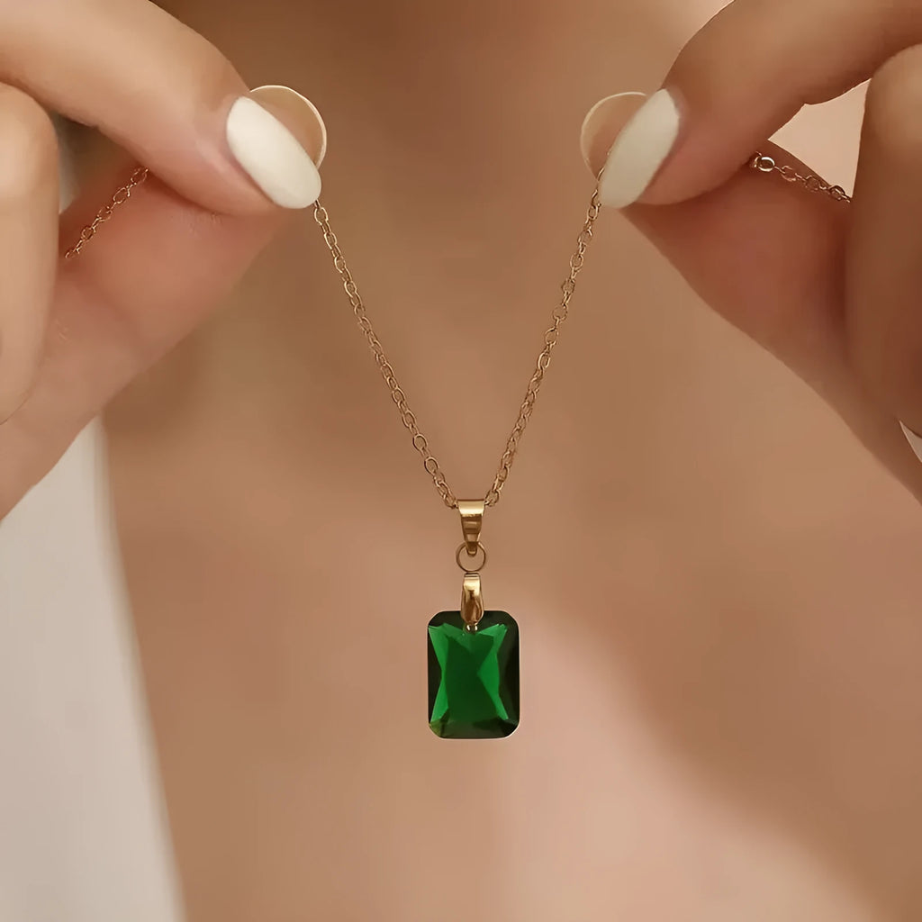 Rectangular copper pendant necklace with geometric quadrilateral design and green finish on O-ring chain.