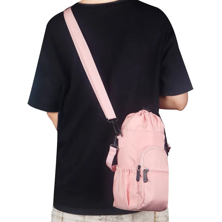 Cloth water bottle pouch crossbody bag with adjustable strap in black, green, and pink.