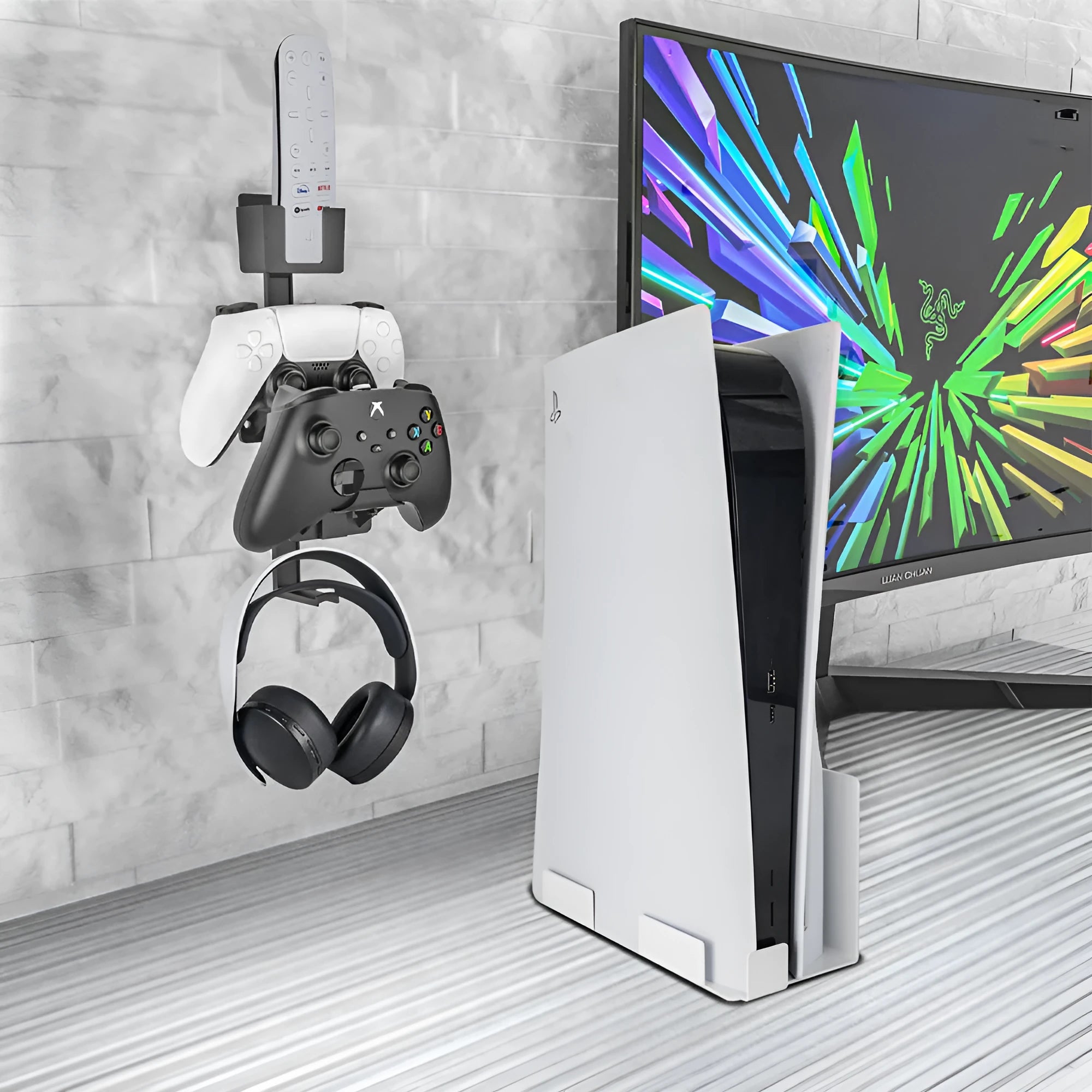 White self-adhesive wall hook holding a black gaming controller and headset.