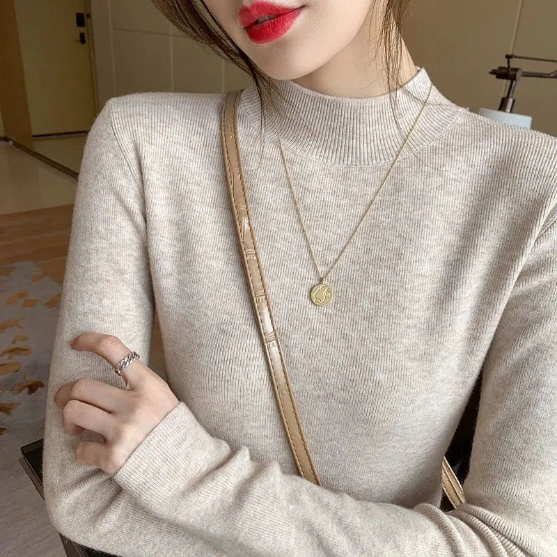 Women's slim fit knitted bottoming shirt in viscose fibre with long sleeves, shown in apricot colour