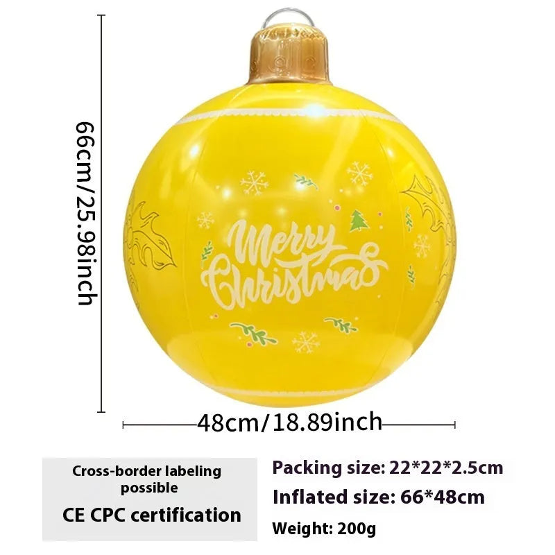 Large inflatable Christmas ball decoration with LED lights in garden setting