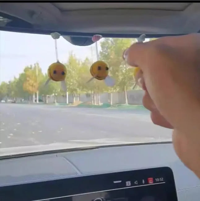 Cartoon bee car decoration ornament with furry ball material measuring 3x3cm
