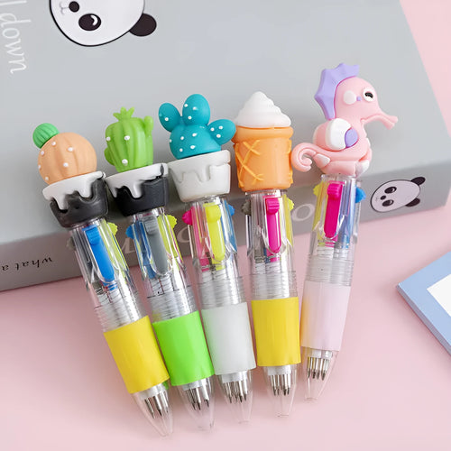 A four-colour ballpoint pen with a press top and a colourful cartoon silicone grip, showing one of five random designs.