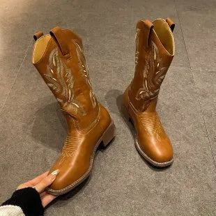 Brown women's embroidered mid-calf Martin boots with a round toe and low square heel.
