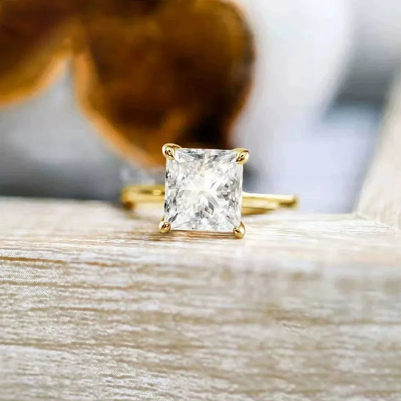 A geometric 925 silver ring with a round zirconium detail, shown in silver, gold, and rose gold finishes.