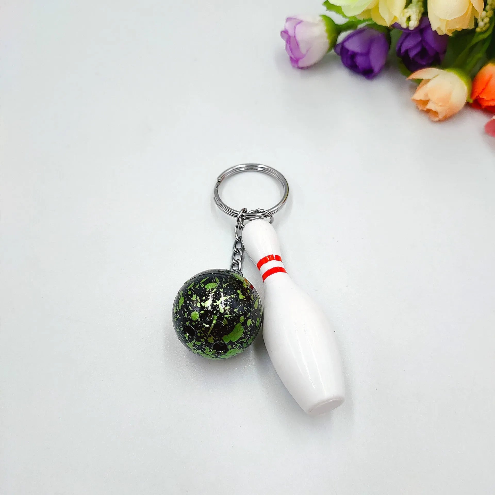 Mini bowling ball keychain pendant in blue colour with metal ring