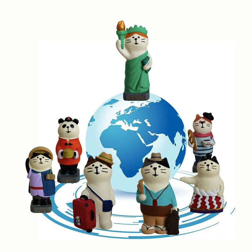 Cartoon cat Statue of Liberty resin figurine on travel-themed base.