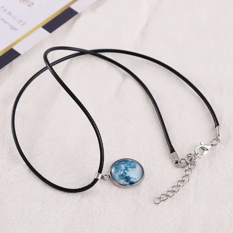 Luminous alloy unisex necklace with organic glass constellation pendant on adjustable glass chain.