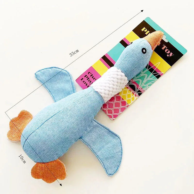 Blue duck-shaped plush dog toy with squeakers for chewing and play