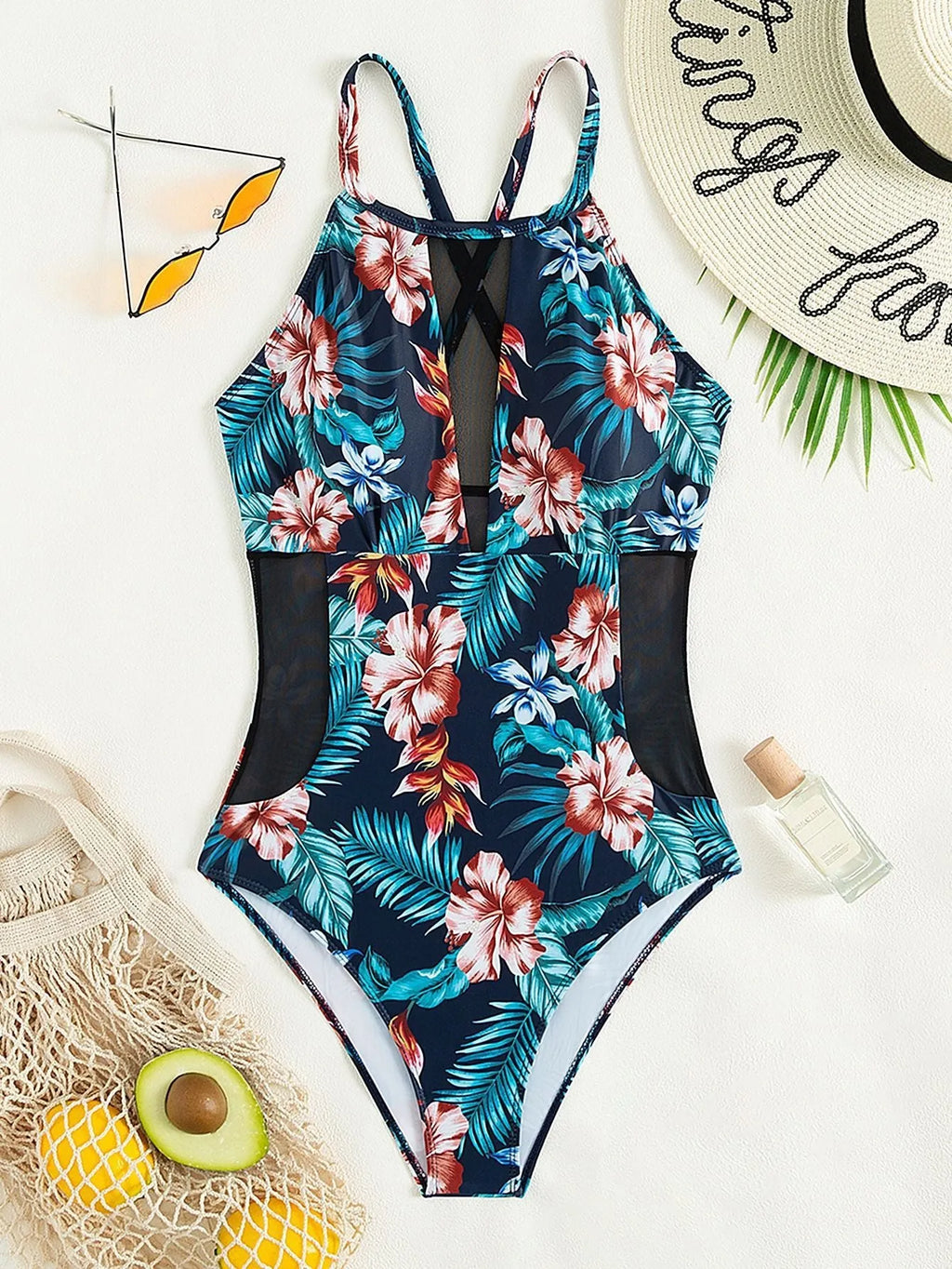 Women's deep V-neck one-piece swimsuit in a printed design, available in sizes S to XL.