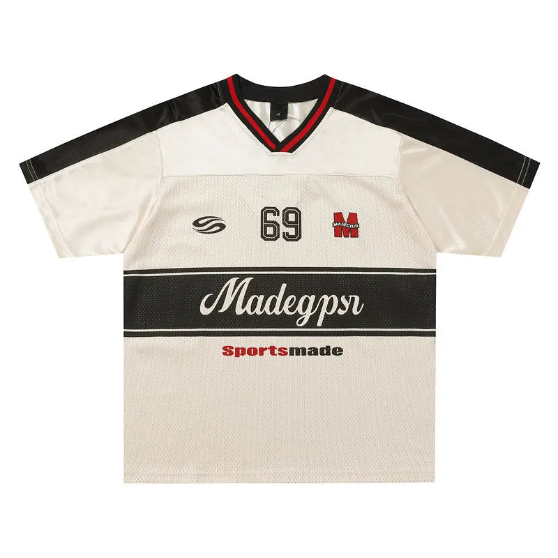 Apricot coloured men's V-neck short sleeve sports jersey with a loose fit and letter pattern detail.
