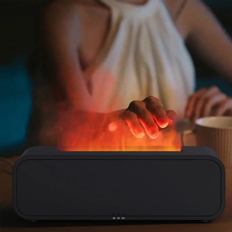 Black and white flame dynamic aroma diffuser with remote control on wooden table