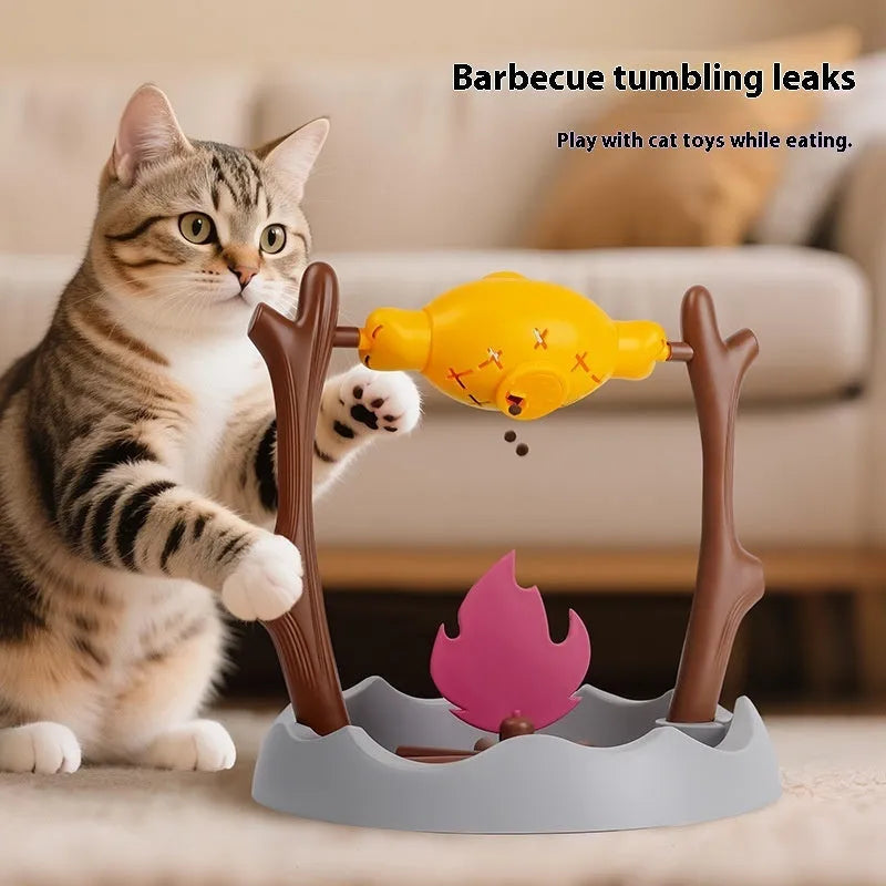 Barbecue-style tumbling interactive cat feeder toy with food compartments, 30cm cube.