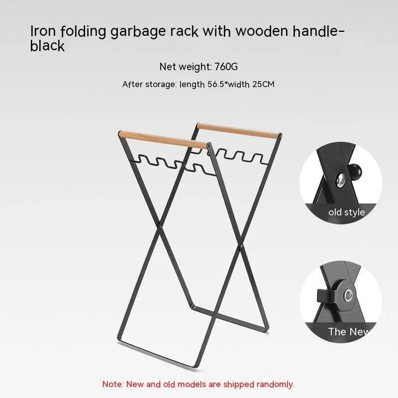 Black folding iron outdoor trash rack with a wooden handle standing upright.
