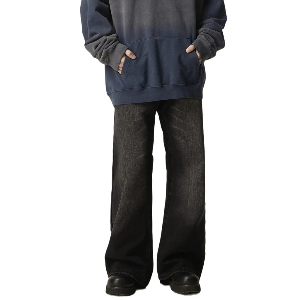 Black loose-fit straight-leg retro jeans on a mannequin, showing zip fly and casual style.