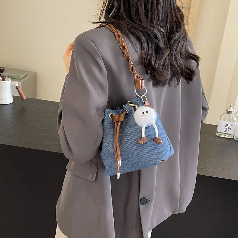 Blue synthetic leather cross body bucket messenger bag with sandwich pocket design