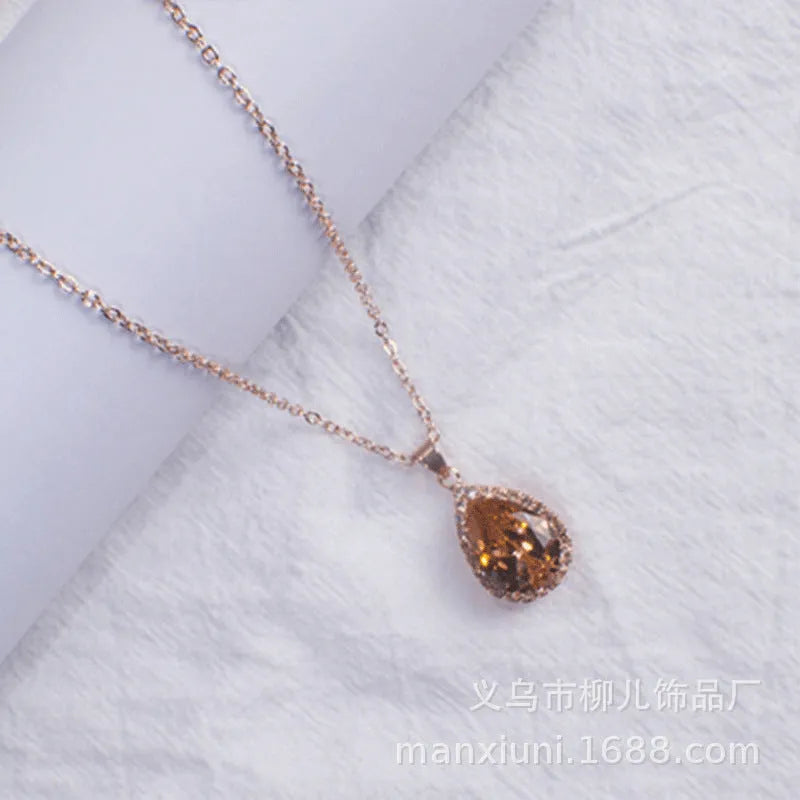 Drop shape geometric pendant necklace with rhinestone inlay in pink rose gold electroplated finish