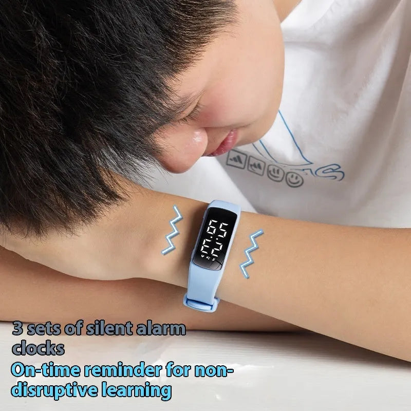 Waterproof vibration alarm clock watch with black silicone strap and LED display showing time