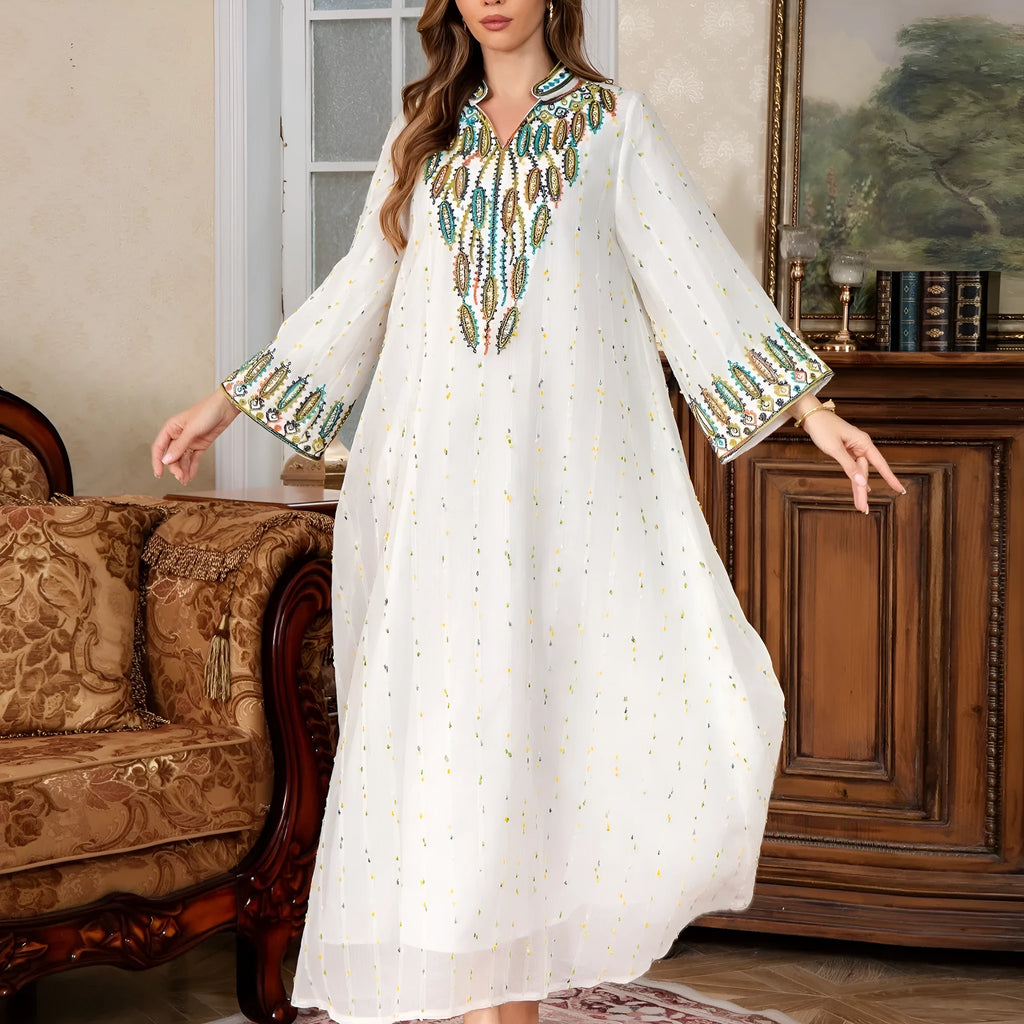 White long sleeve Arabic robe for women made from polyester, shown in a long skirt style.
