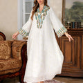 White long sleeve Arabic robe for women made from polyester, shown in a long skirt style.