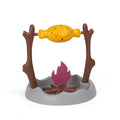 Barbecue-style tumbling interactive cat feeder toy with food compartments, 30cm cube.
