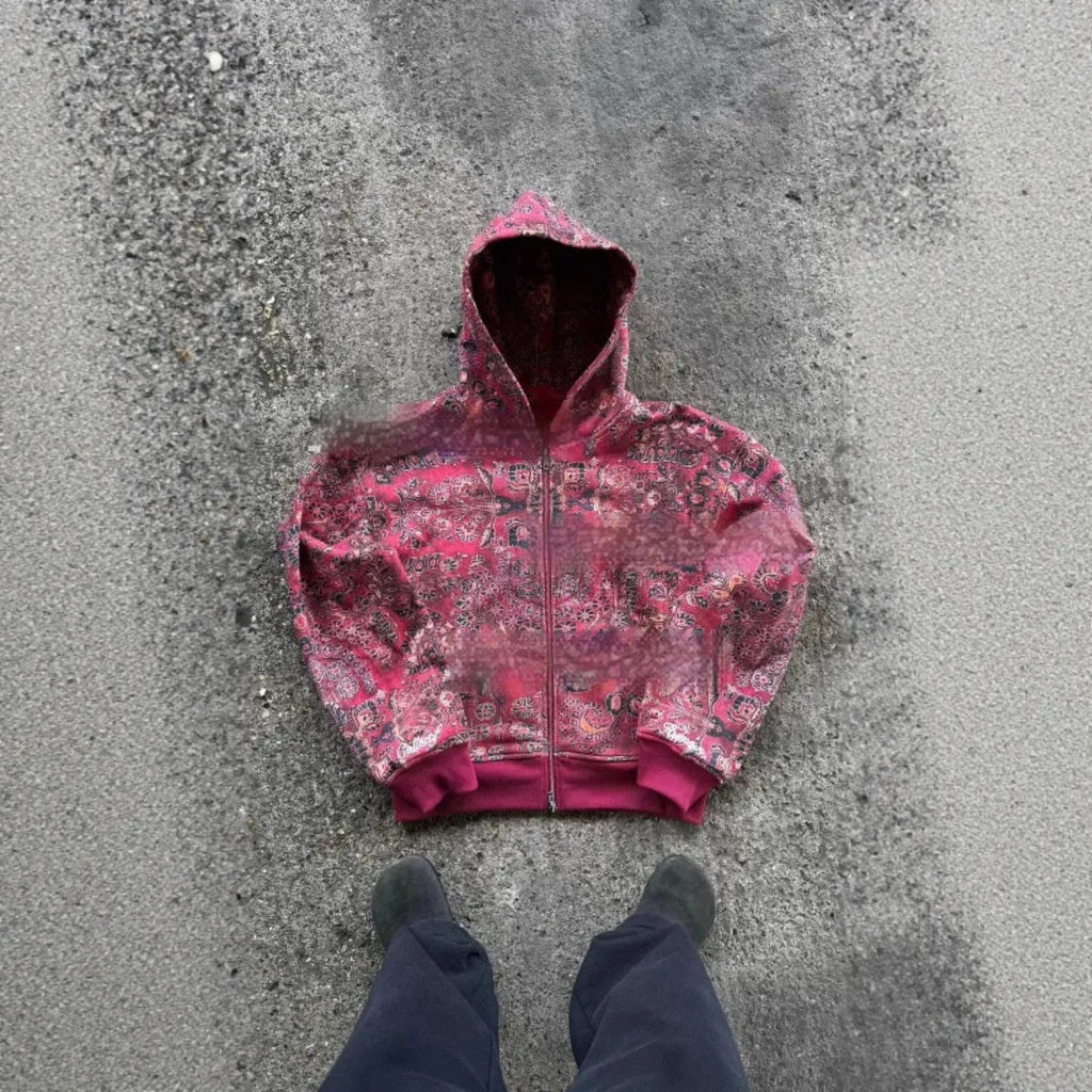 Man wearing a blue loose-fit hooded zip coat with digital print, long sleeves, for casual autumn wear.