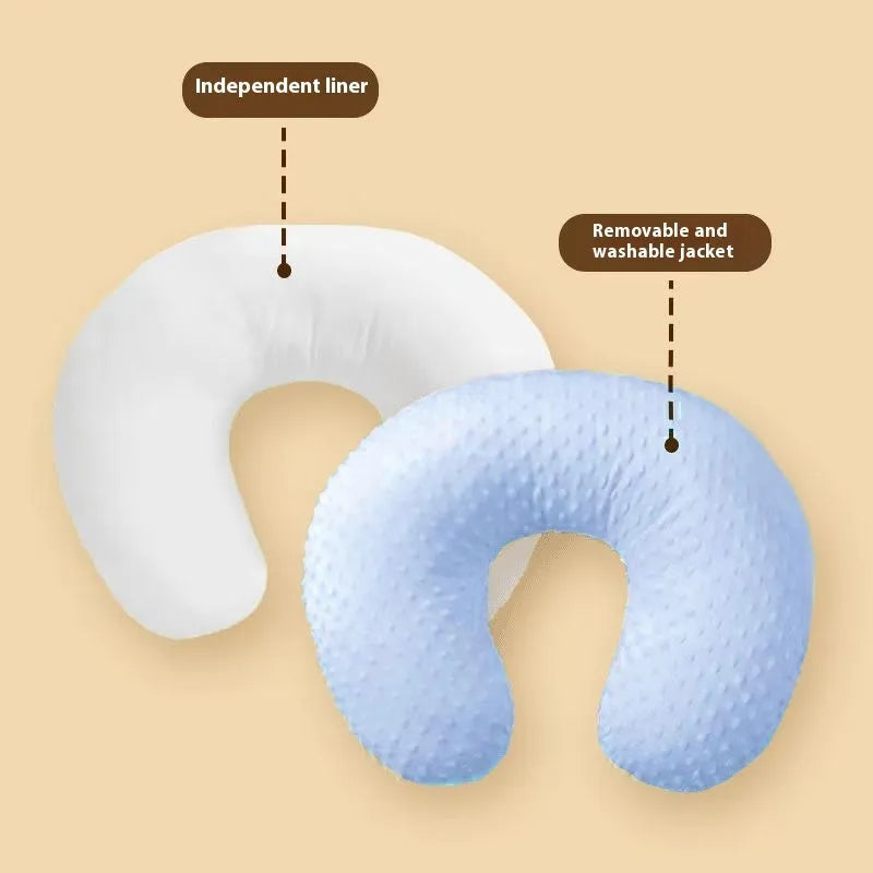 Multifunctional nursing pillow with a removable cover in grey, designed for feeding support and spill prevention.