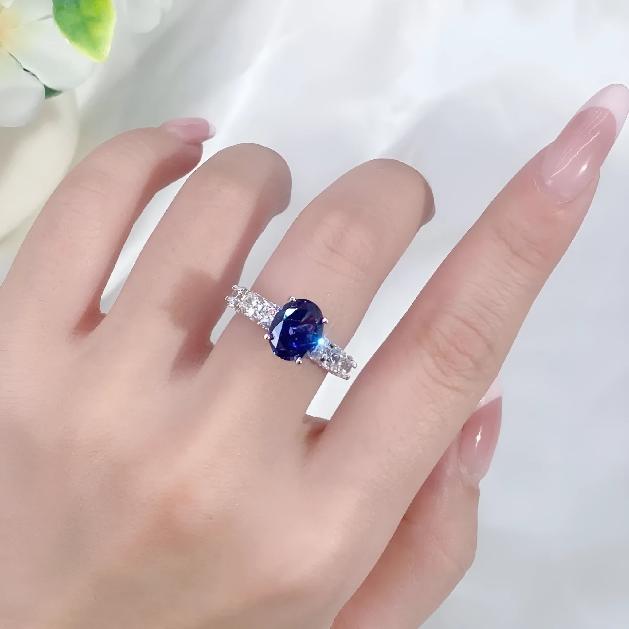 Close-up of a women's heart-shaped sterling silver ring with an ice flower cut tan sang colour zircon stone.