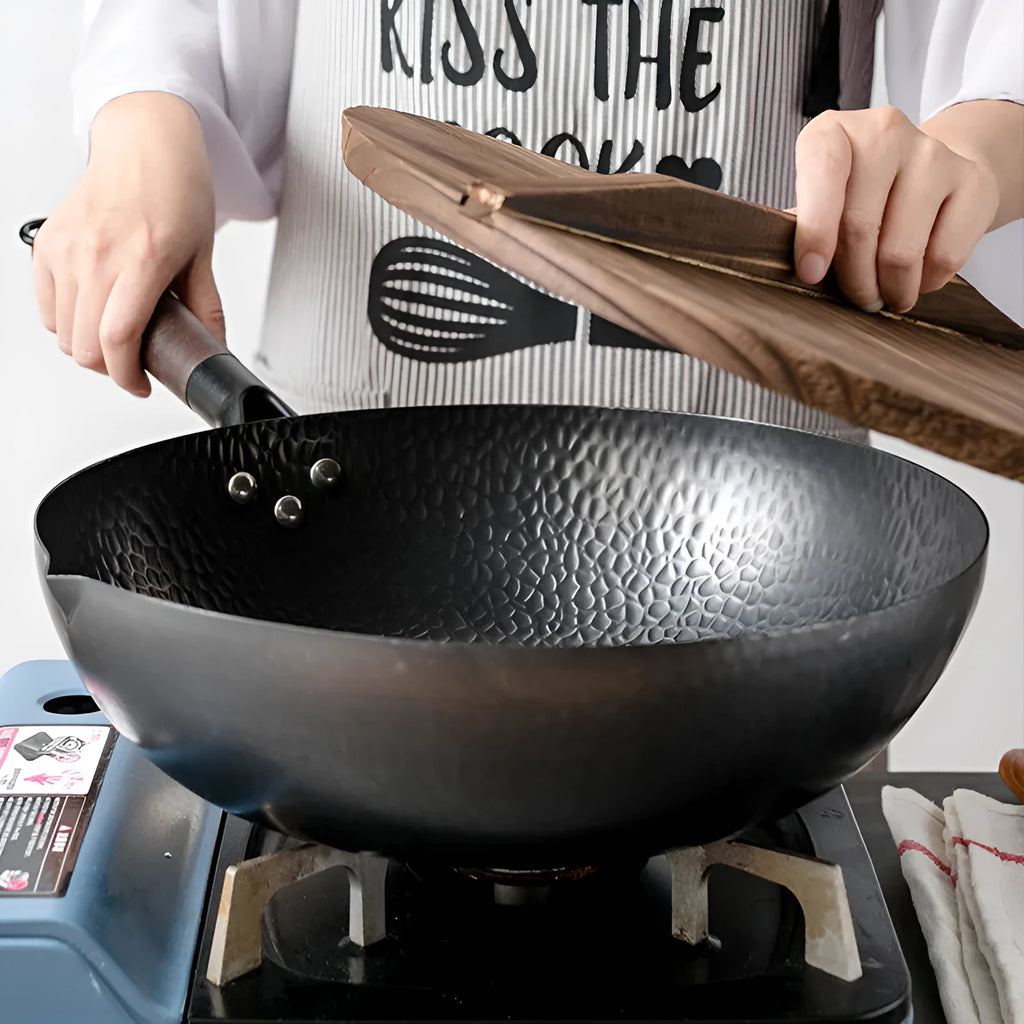 Traditional black iron wok with wooden handle showing 40cm diameter and flat induction base