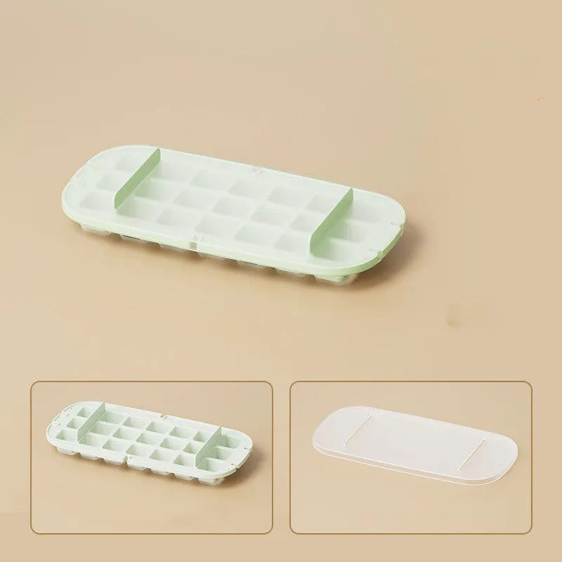 Yellow lever-operated ice cube tray grid with high capacity design and stored ice shovel.
