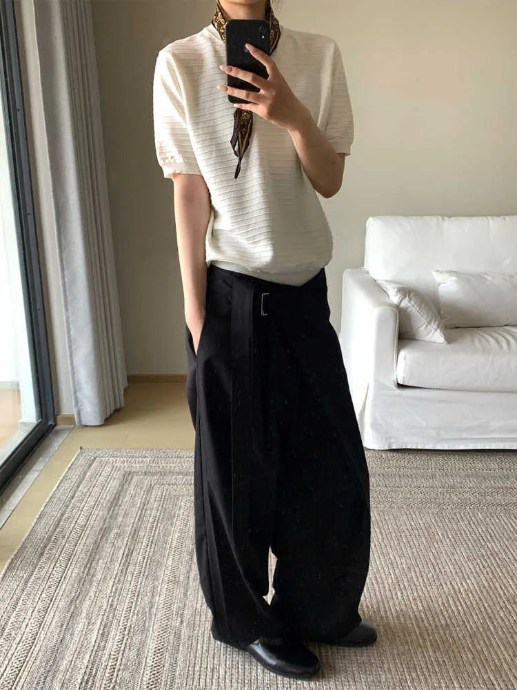 Black loose fit straight-leg trousers with adjustable waistband and single pleat detail
