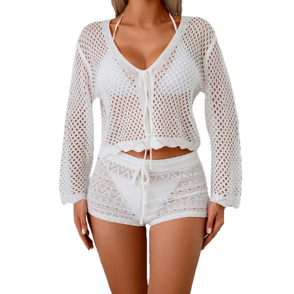 Women's apricot bell sleeve hollow knit cardigan blouse on a hanger.