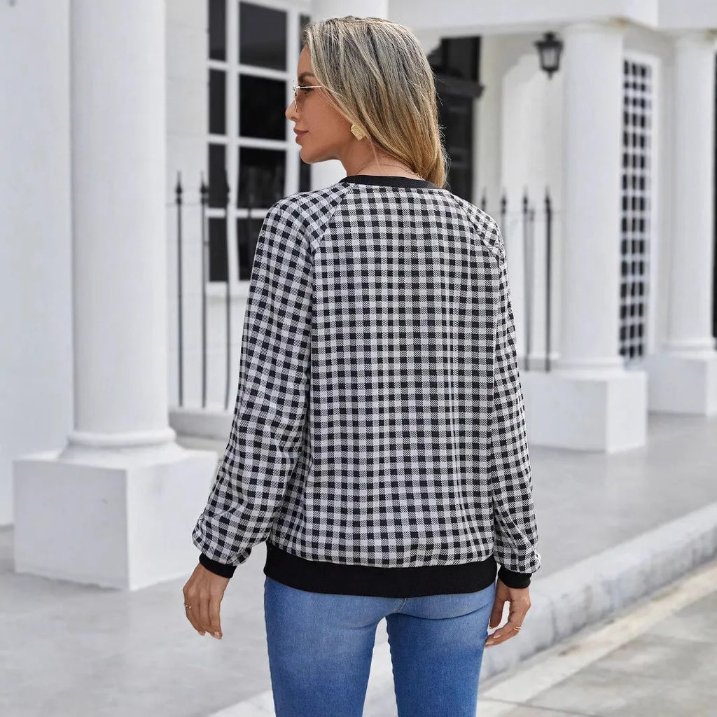 Black long sleeve pullover sweater with a Japanese sweet plaid striped pattern.