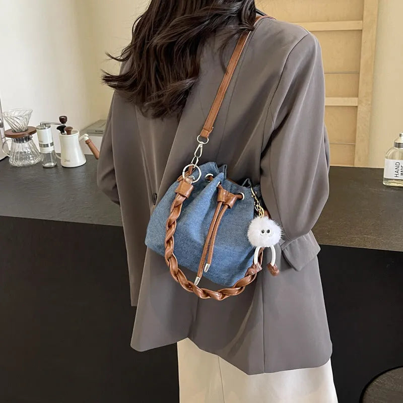 Blue synthetic leather cross body bucket messenger bag with sandwich pocket design